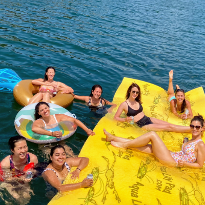 a group of people on a raft in a body of water
