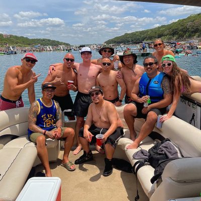 a group of people sitting at a beach