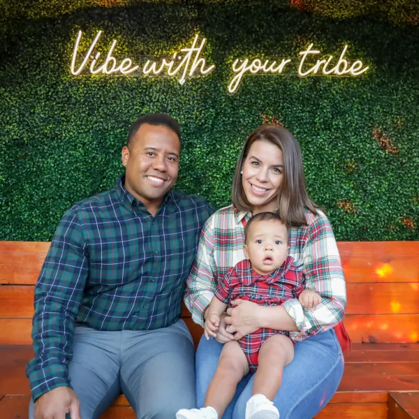 a girl sitting on a bench posing for the camera