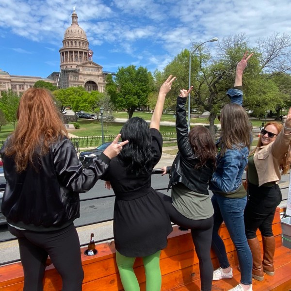 a group of people standing in front of a building