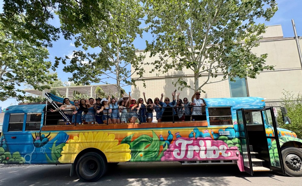 a colorful truck is driving down the road